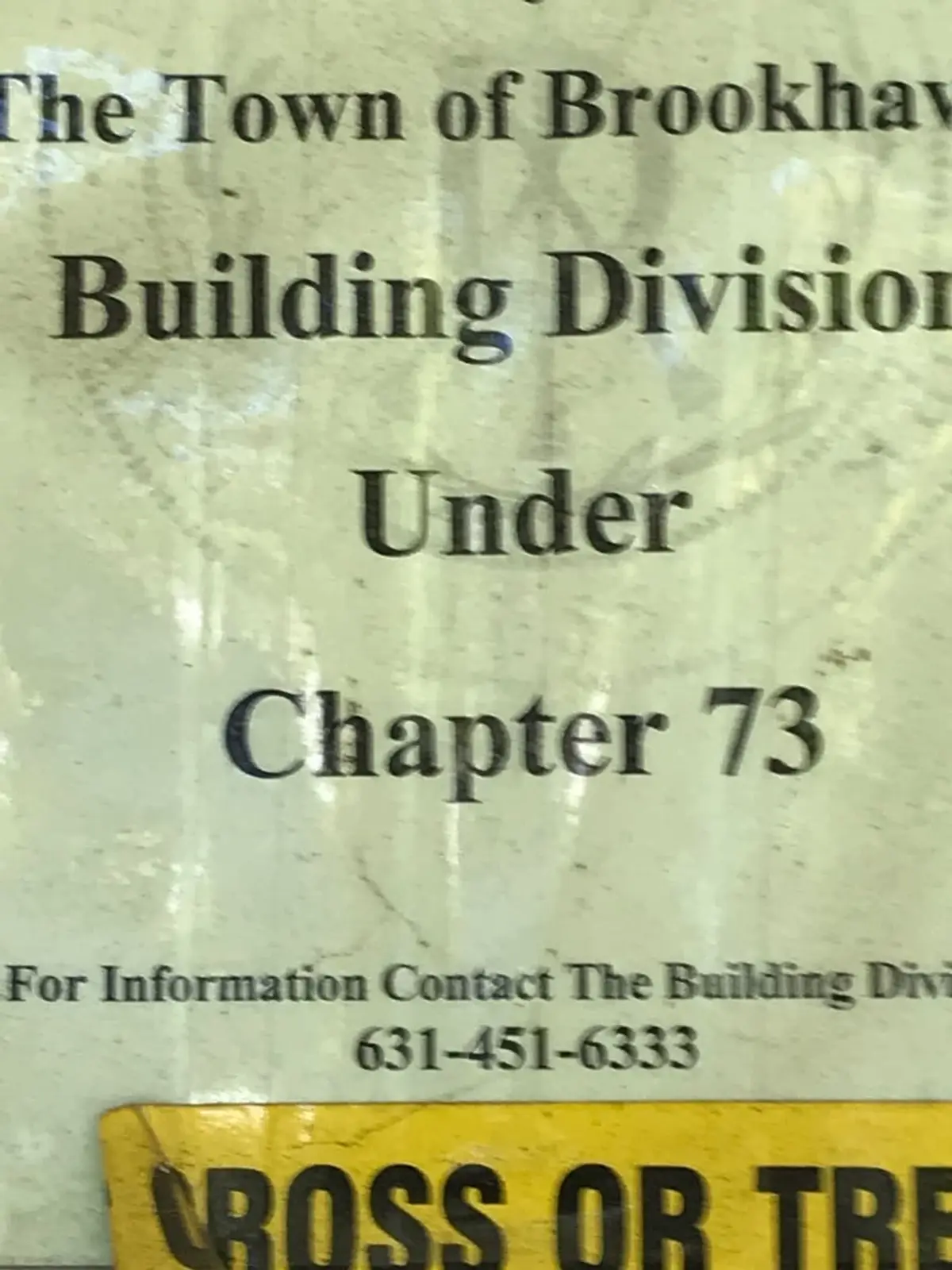 Selling a condemned house in Mastic: town building division notice posted on the house